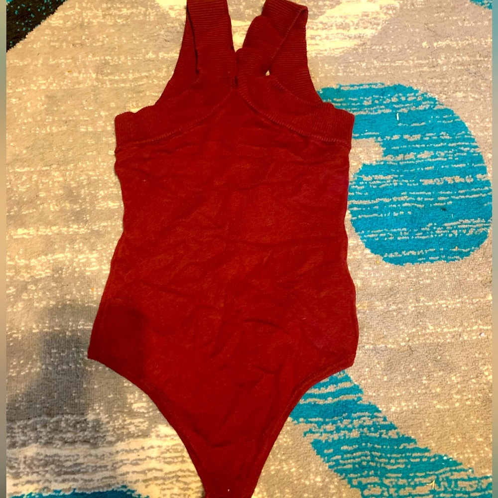This is a Le Lis bodysuit that has never been worn and is very fashionable